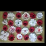 Photo of red and white knitted poppies
