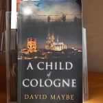 Cover of the book 'A child of Cologne' showing the cathedral.