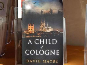 Cover of the book 'A child of Cologne' showing the cathedral.